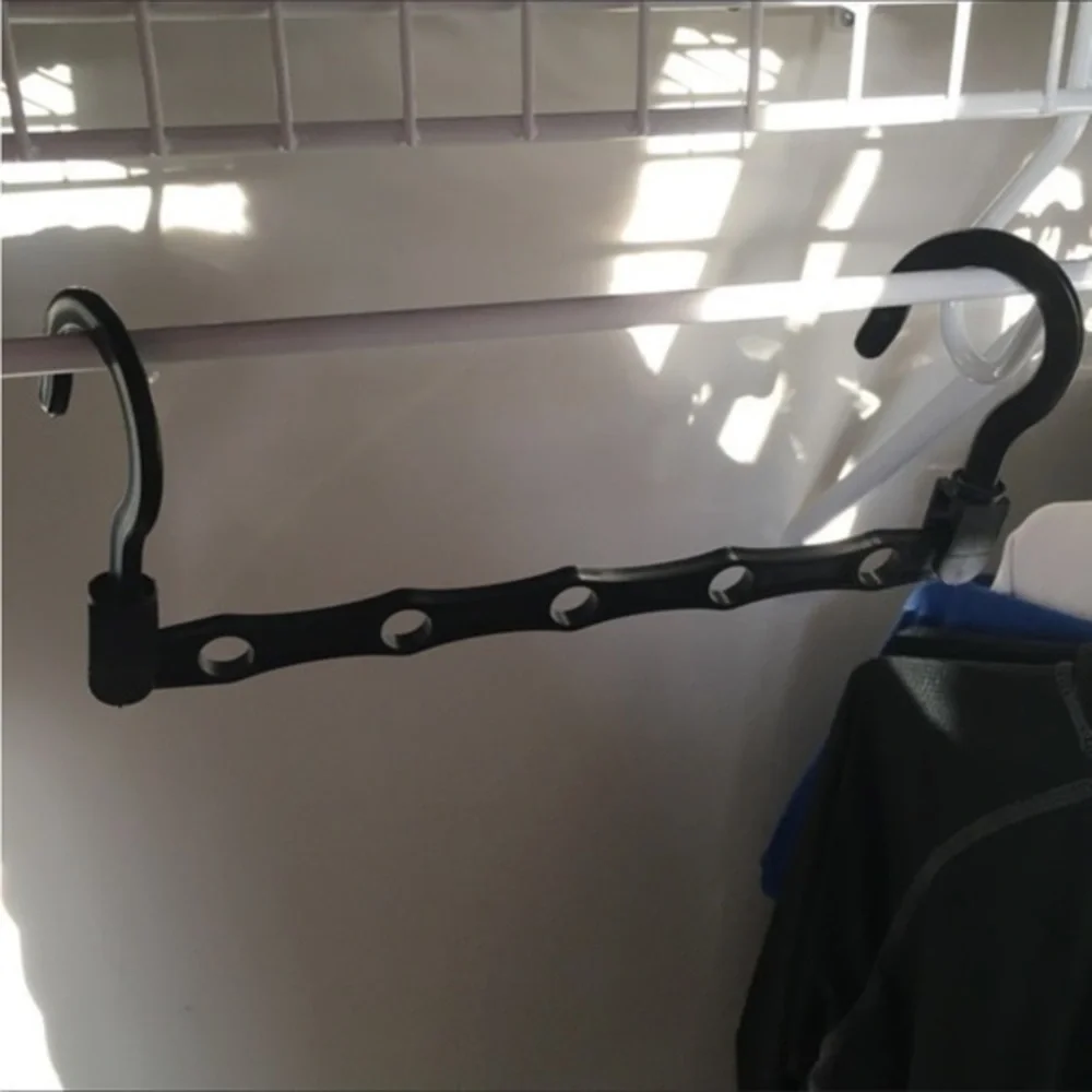 THE ULTIMATE SPACE SAVER: Wonder Hanger Max. Set includes 5 black Wonder Hangers